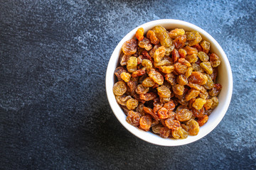 raisins, delicious dried grapes (fresh fruit vitamins) menu concept background. top view. copy space for text keto or paleo diet