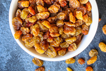 raisins, delicious dried grapes (fresh fruit vitamins) menu concept background. top view. copy space for text keto or paleo diet