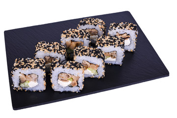 Traditional fresh japanese sushi rolls on black stone Seigun on a white background. Roll ingredients: philadelphia cheese, shiitaki mushroom, tomago omelet, avocado, nori, rice, sesame mix.