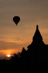 Fototapeta na wymiar Scenic sunrise with hot air balloons over Bagan in Myanmar.