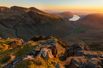 Obraz premium Beautiful Sunset High Up In Mountains With Wastwater Lake In Distance, Lake District, UK.