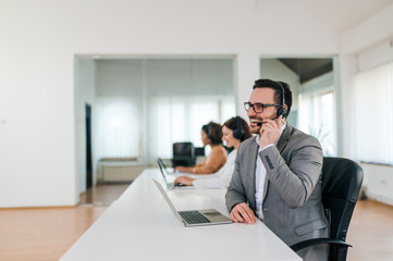 Portrait of a sales agent working in co working office.