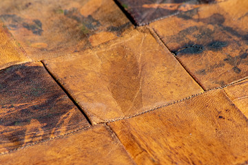 Pieces of old leather combined together in bright diagonal paternPieces of old leather combined together in bright diagonal patern