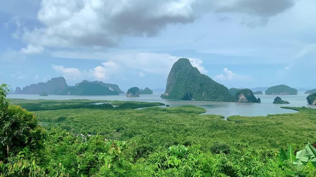 Phang Nga Bay viewpoint in Thailand. Steadicam shot of natural paradise, shallow bay with islands and mangrove. phuket, asia. beautiful sunny day and freen rainforest
