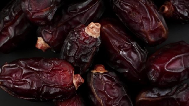 Close-up date fruit (hurma) revolves around itself