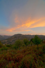 sunset in the desert waiting for the starry sky with hills in summer