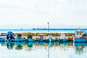 Fototapeta na wymiar Traditional greece boats docked in the port of Evia