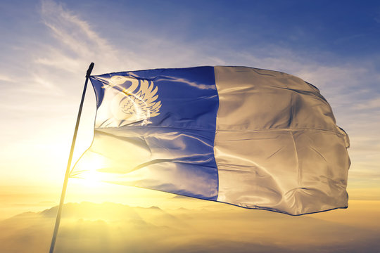 Tongeren of Limburg of Belgium flag waving on the top sunrise mist fog