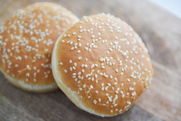wheat bun with sesame seeds on a wooden table hamburger ingredients
