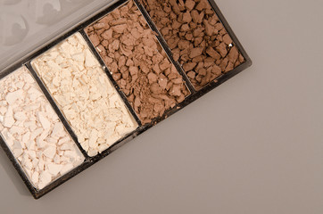 brushes, shadows, pallets, lipsticks, powder, blush, mascara, make-up cosmetics on an isolated background