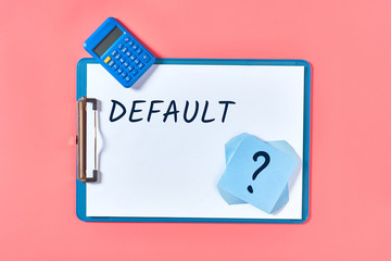 Clipboard with words default near stationery items on pink desk. Business concept