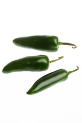 Hot green jalapeno peppers isolated on white background.