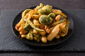 Japanese vegetable tempura on black background
