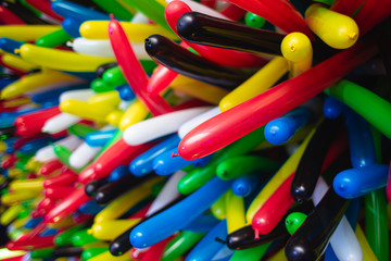 Background of multi-colored long balloons for a birthday party