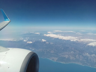 Aerial view of the sky, clouds, mountains and sea. Photo for printing in a magazine, poster, or banner.