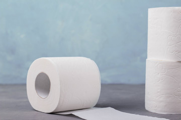 toilet paper rolls on a blue background