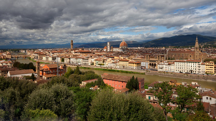 Fototapeta na wymiar Florence - view at Arno river and old town of Florence. Santa Croce, Florence Cathedral (Duomo di Firenze). Tuscany, Italy.