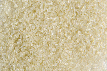 Polypropylene granule close-up background texture. plastic resin ( Masterbatch).Grey chemical granules for industrial plastic production