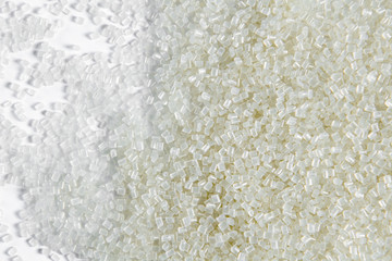 Polypropylene granule close-up background texture. plastic resin ( Masterbatch).Grey chemical granules for industrial plastic production
