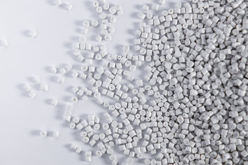 Polypropylene granule close-up background texture. plastic resin ( Masterbatch).Grey chemical granules for industrial plastic production