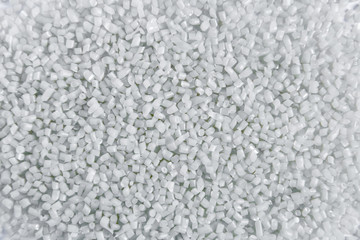 Polypropylene granule close-up background texture. plastic resin ( Masterbatch).Grey chemical granules for industrial plastic production