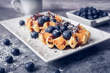 Waffles with blueberries and chocolate