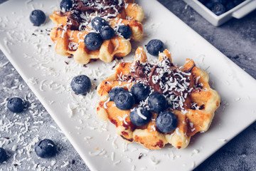 Waffles with blueberries and chocolate