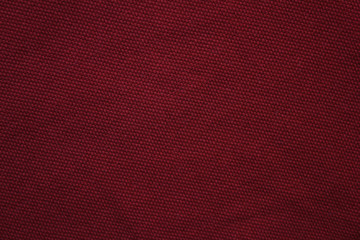 Dark burgundy red fabric texture background, empty abstract close up brown tone wallpaper. Empty...