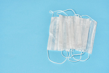 white medical masks on blue background.
