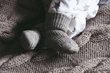 Newborn baby feet in socks