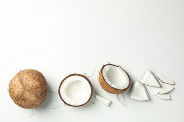 Flat lay with coconut on white background, top view