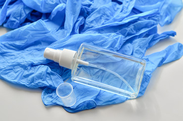  Disposable latex gloves in blue. Antiseptic in a transparent flocon.