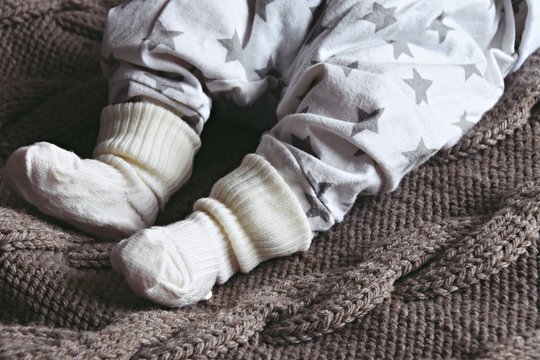 Newborn baby feet in socks