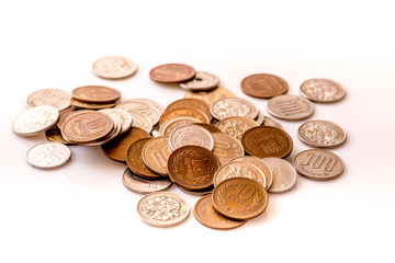 Japanese coins and banknotes and passport on white table