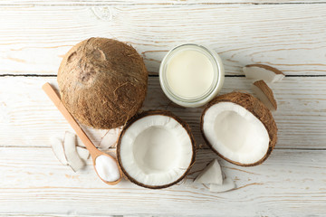Fototapeta na wymiar Coconut and milk on wooden background. Tropical fruit