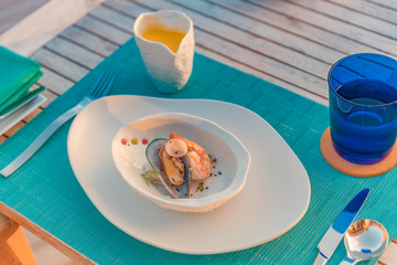 Seafood serving creative cuisine mediterranean gourmet delicatessen food restaurant concept. Elegant outdoor restaurant