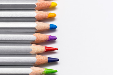Obraz premium gray wooden pencils with colored rods on a white background