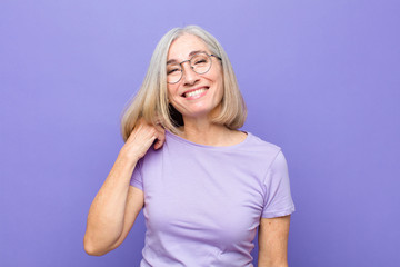 senior or middle age pretty woman laughing cheerfully and confidently with a casual, happy, friendly smile