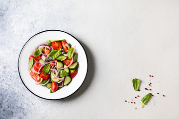 Fresh vegetable salad. Vegetarian food.Concept for a tasty and healthy meal.Top view.Copy space