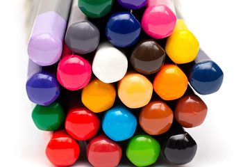 colored back of wooden gray pencils with colored rods on a white background