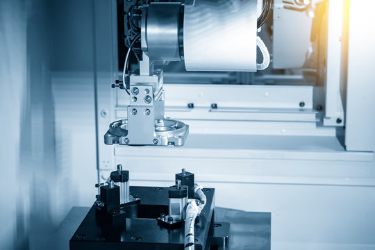 The robotic arm system working with  the CNC milling machine for parts setup process .The  hi-technology automotive part manufacturing process by robotic system.