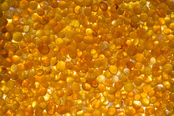 Golden silica gel dessicant reflecting light