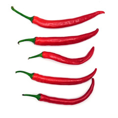 Five fresh juicy peppers isolated on a white background. Above view.