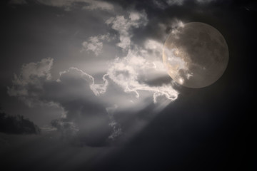 Naklejka na ściany i meble Cloudy full moon night with moonbeams