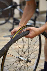 Fototapeta na wymiar Dismantling modern bicycle wheel tire