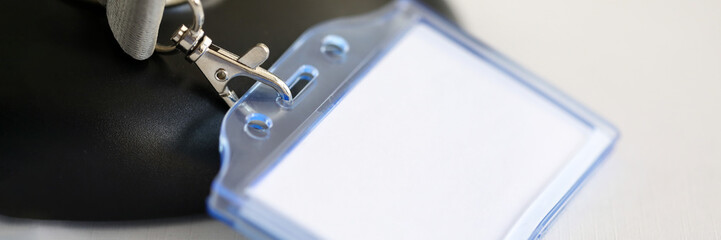On table is plastic badge plaque, an empty badge