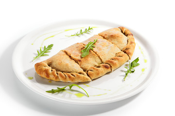 Calzone pizza with Parma ham, tomatoes and mozzarella