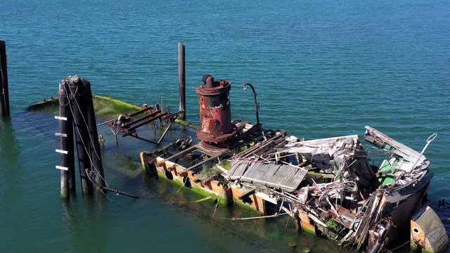 A steamer build in 1881 in Gold Beach now resting in peace in the Rouge River where it sank in 1985 now an important piece of culture and history and a valuable landmark in Gold Beach, Oregon 