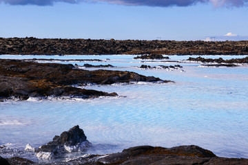 Obraz premium clear water sky blue colors on a lava field. The blue Lagoon in Iceland