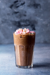 Glass of Tasty Chocolate Milk Shake with Marshmallow on Blue Background Tasty Cocoa Vertical